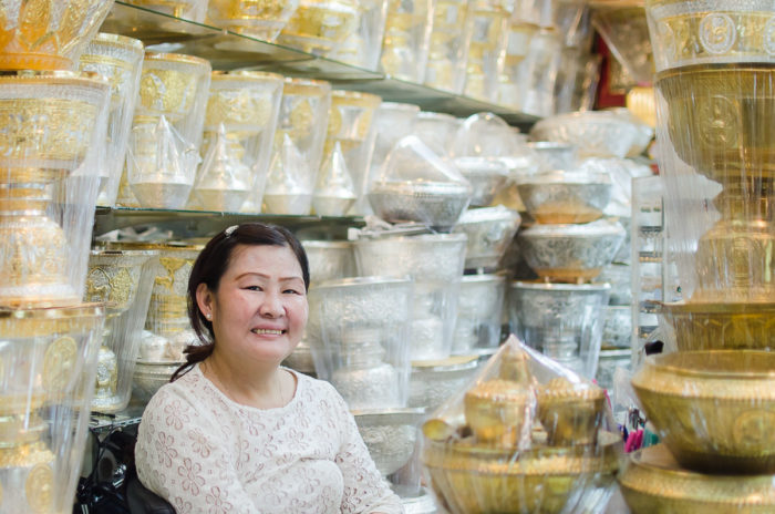Portrait of a woman at her shop in the market in Vientiane in Laos taken by Milie Del