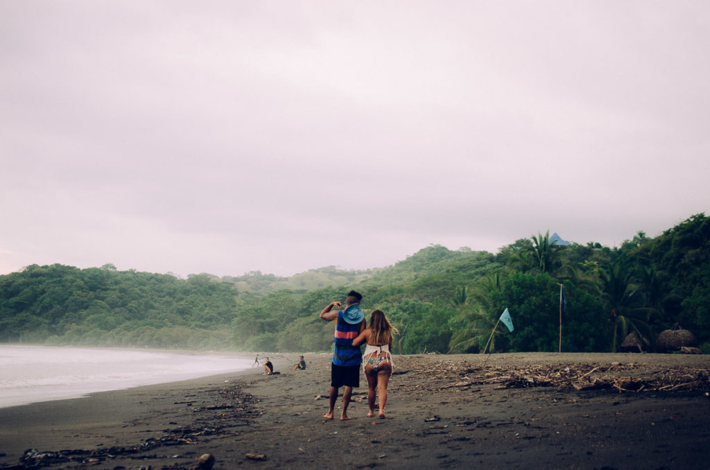 Couple youth walking beach sunset Pedasi Panama