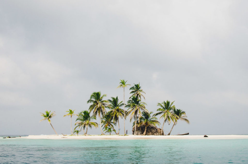 Man standing dreamy island San Blas Archipelago