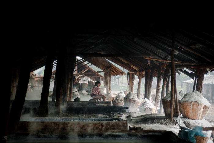 Salt of the earth girl silhouette in a salt factory under the rain near Vientiane Laos taken by Milie Del