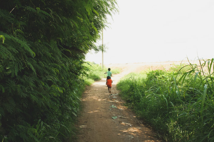 Kids running in Laos taken by Milie Del
