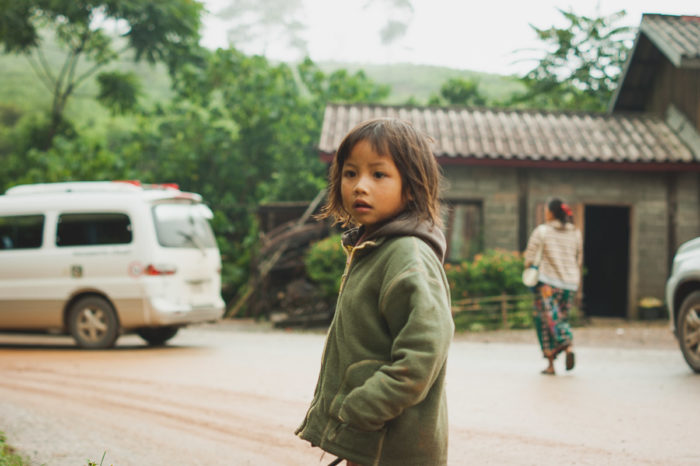 Portrait of a hmong girl on the road to luang prabang in Laos taken by Milie Del