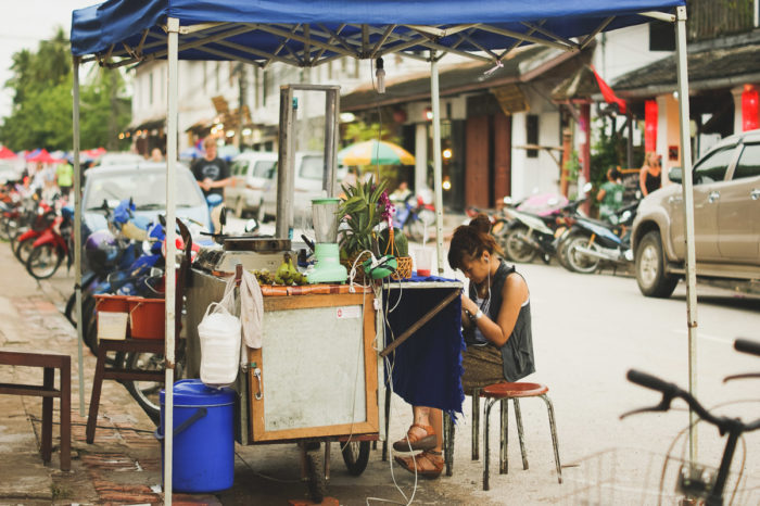 woman selling fruit juice in Luang prabang in Laos taken by Milie Del
