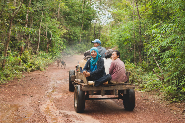 Workers leaving on a trator in Laos taken by Milie Del