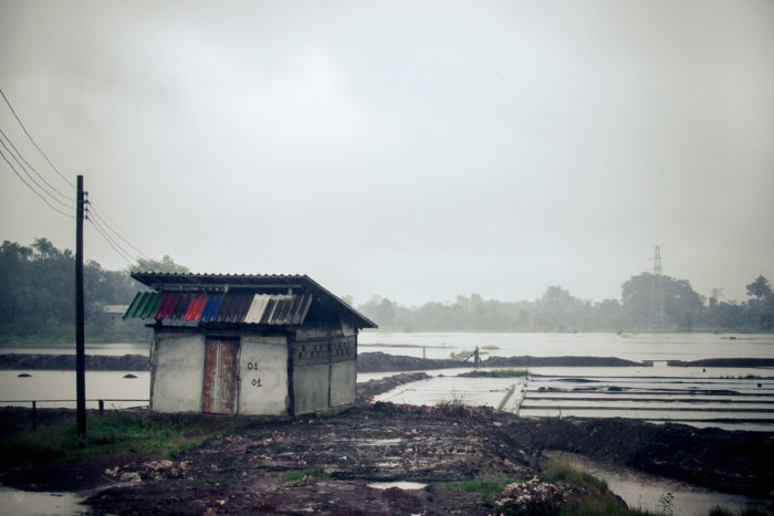 Landscape of a salt factory under the rain near Vientiane Laos taken by Milie Del