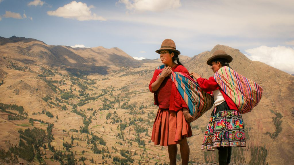 Andes women taking a pause in the mountains in the amary community in Peru taken by Milie Del