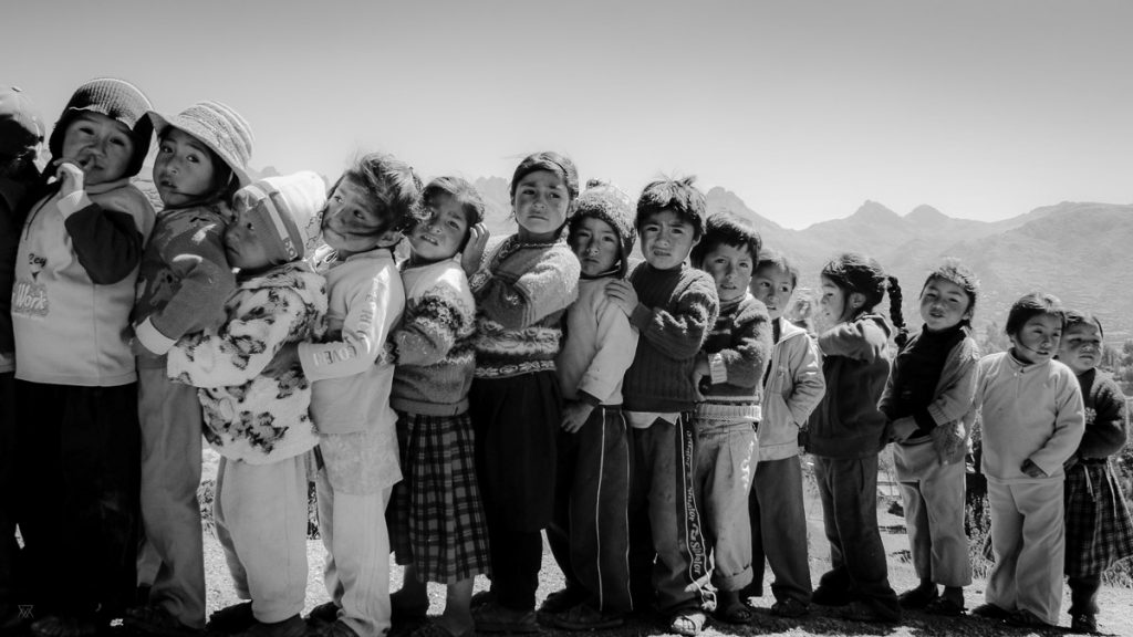 Black and white portraits of Children at school in the amaru community village in Peru taken by Milie Del