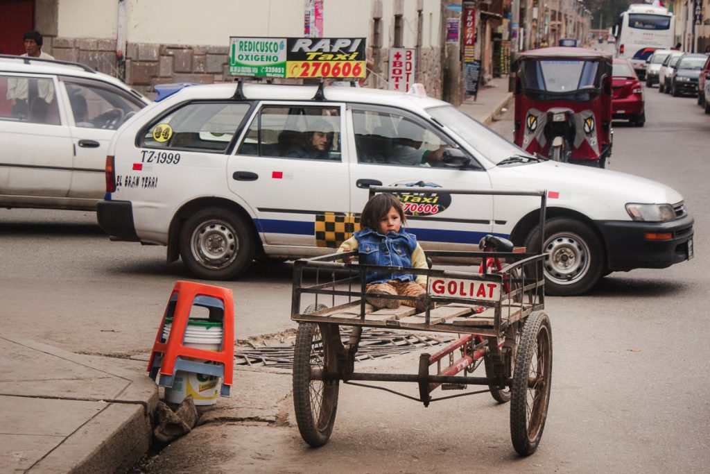 Portrait of a little girl in the streets of Cuzco Peru taken by Milie Del
