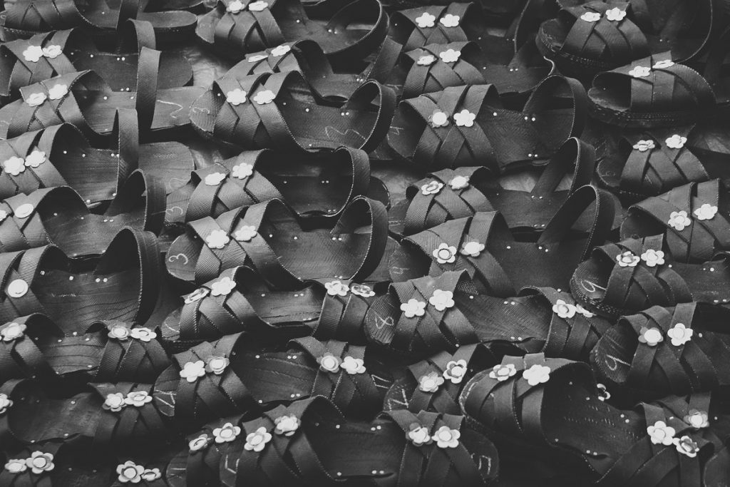 photo of Black and white caoutchou sandals taken in Pisaq Market by Milie Del