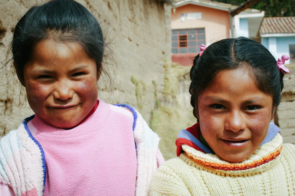 Portrait of two girls outside the school in the amary community in Peru taken by Milie Del