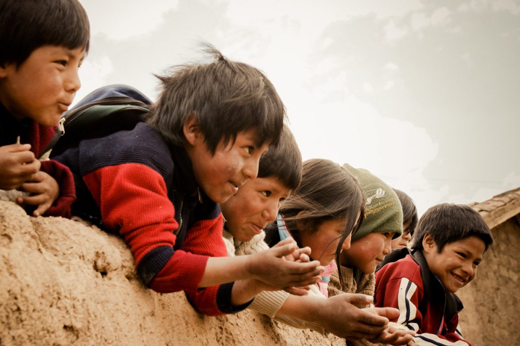 Children playing outside the school in the amary community in Peru taken by Milie Del