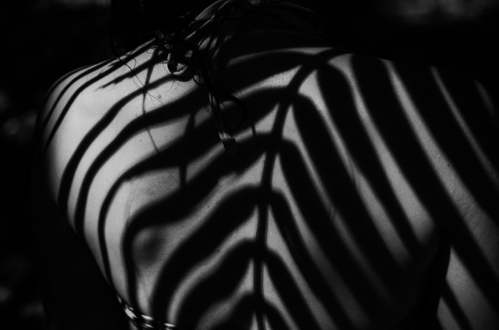 shadows leaves skin woman panama