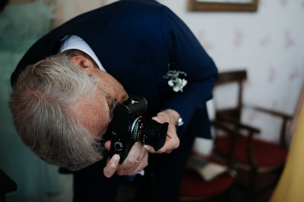 bride's dad taking picture leica
