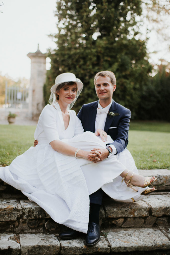 Wedding Couple sitting stairs at sunset hour newly wed