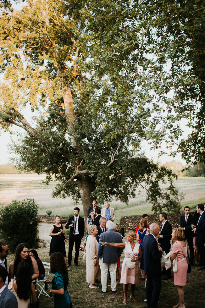 Guests at Wedding boho reception under the fig trees 
