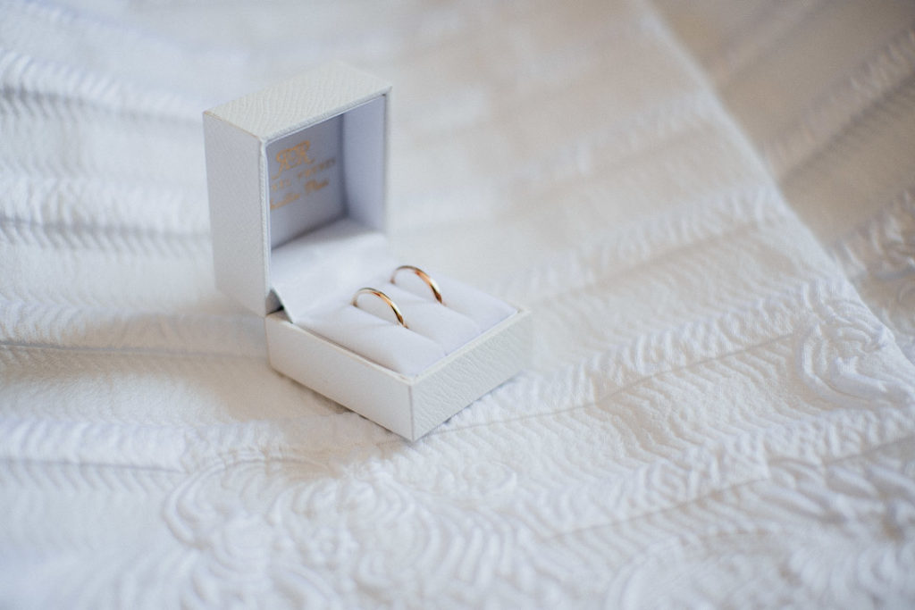 bride and groom rings soft light