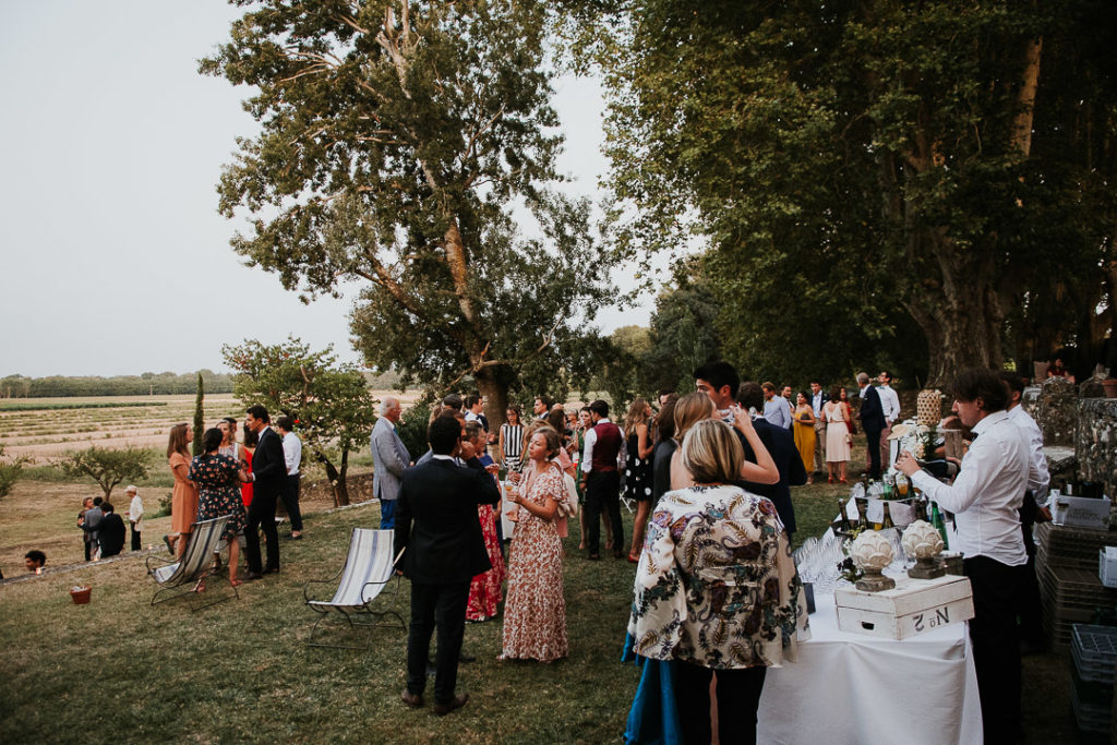 Guests at Wedding boho reception under the fig trees