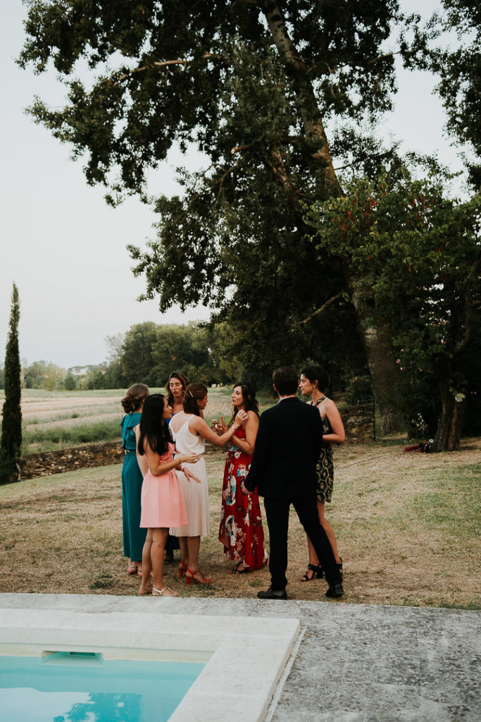 Guests at Wedding boho reception under the fig trees 