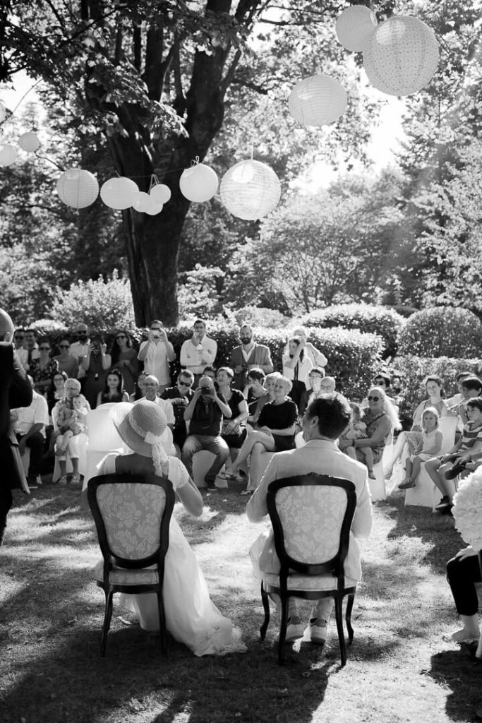 Bride and groom during the outdoor ceremony surrounded