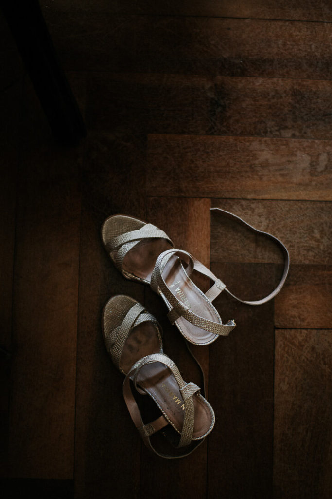 golden wedding shoes wooden floor bridal prep