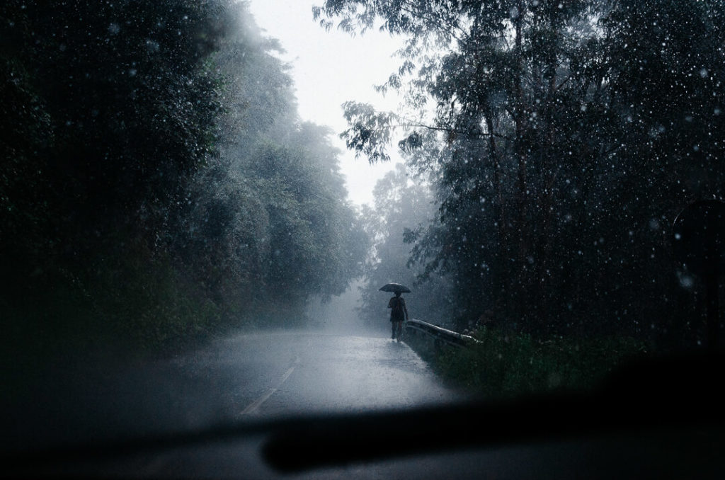 silhouette walking under the storm miliedel photographer