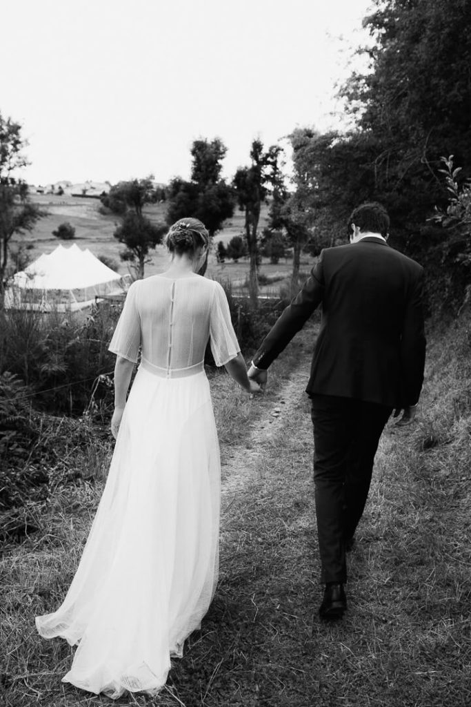 couple engagement session walking away