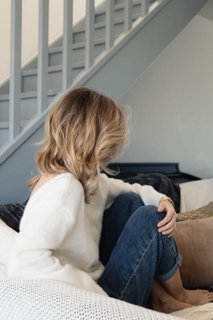 woman couch cosy home interior photography