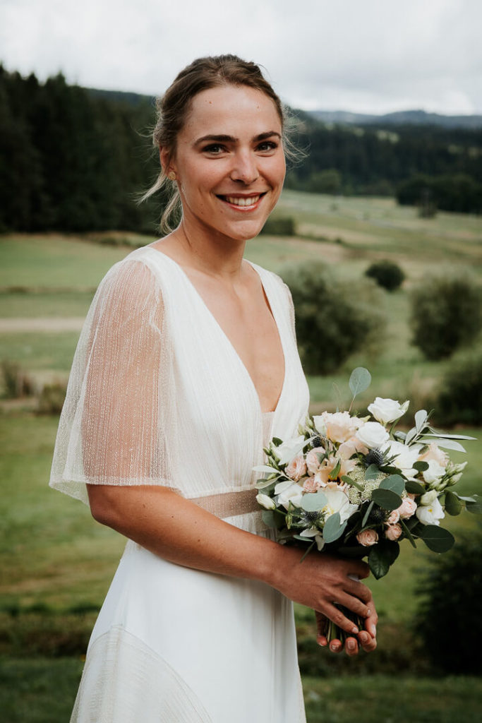 bride with flowers posing