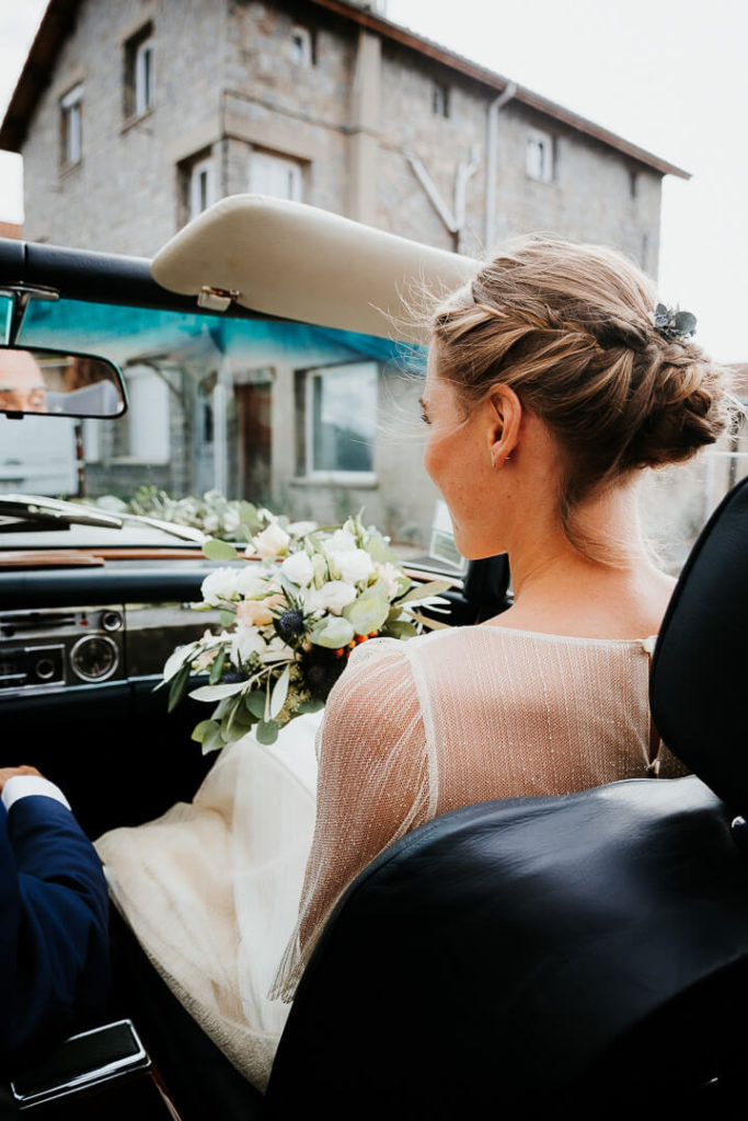 bride in vintage car arriving at the ceremony