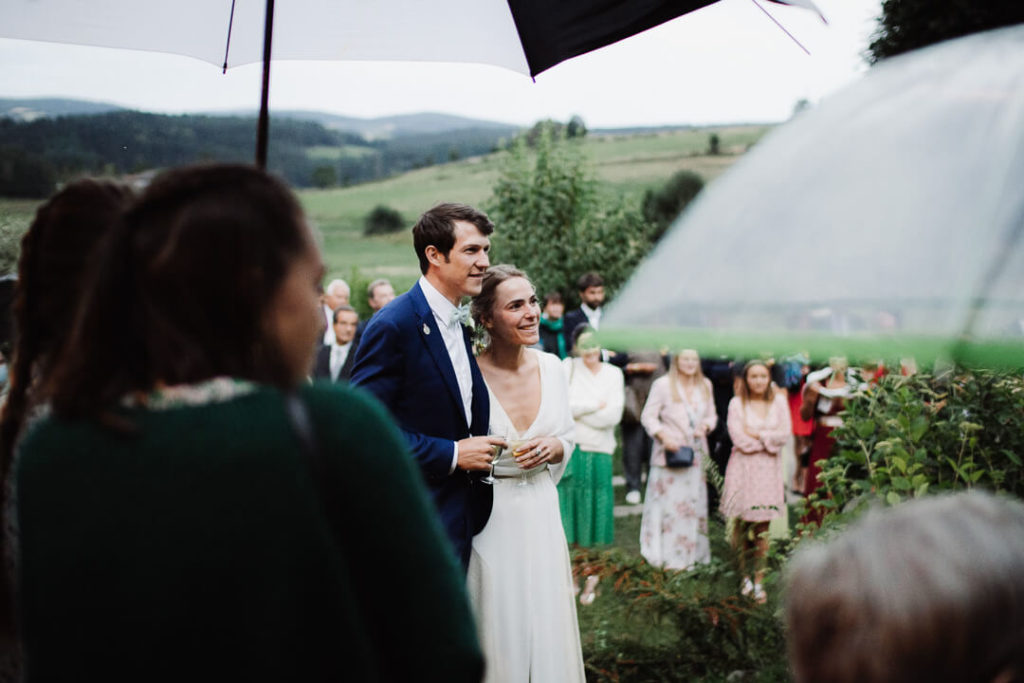 umbrella couple rainy wedding day