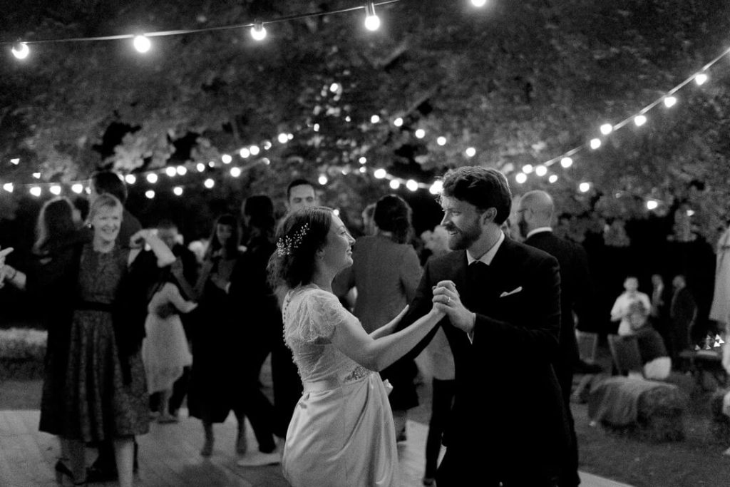 dancing couple at night during wedding festivities