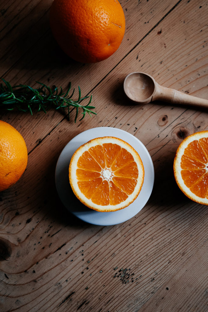 miliedel photographs oranges on a vintage table french photographer