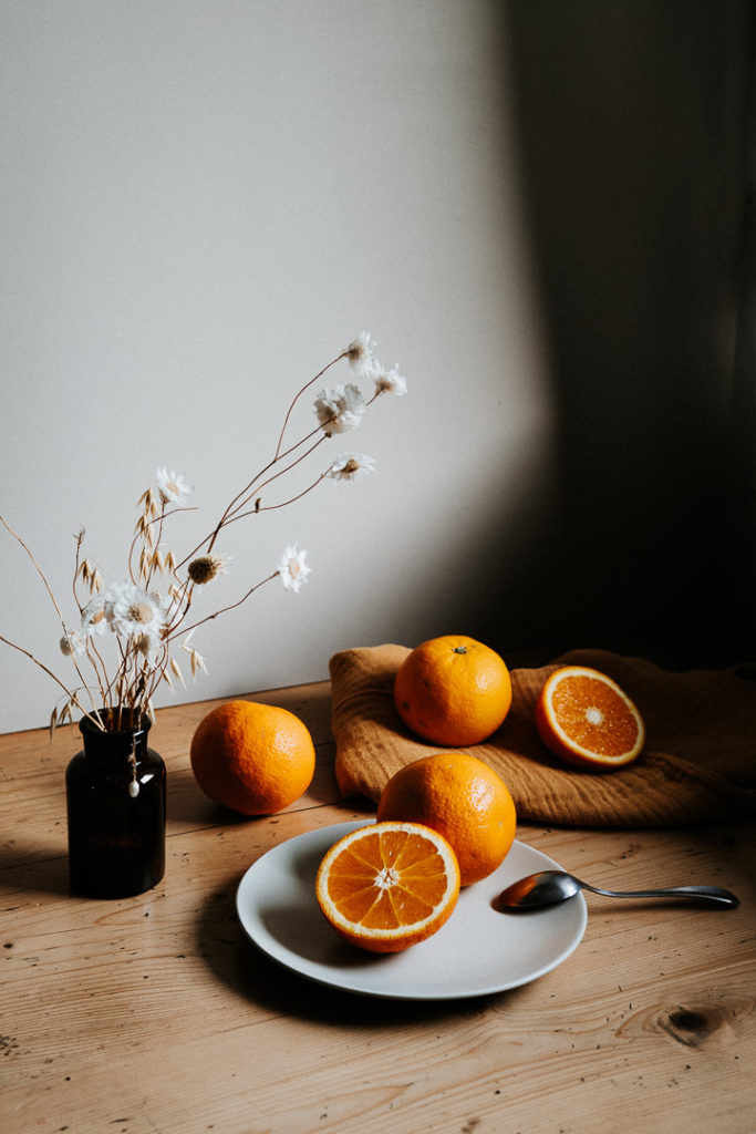 miliedel photographs oranges on a vintage table kinfolk