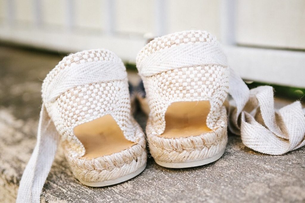 Blue shoes and yellow flowers for summer vibes in South of france by Milie Del Editorial photographer