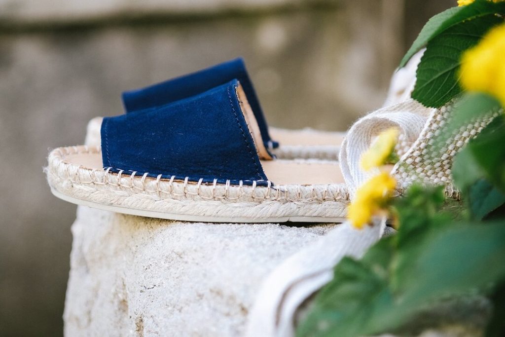 Blue shoes and yellow flowers for summer vibes in South of france by Milie Del Editorial photographer