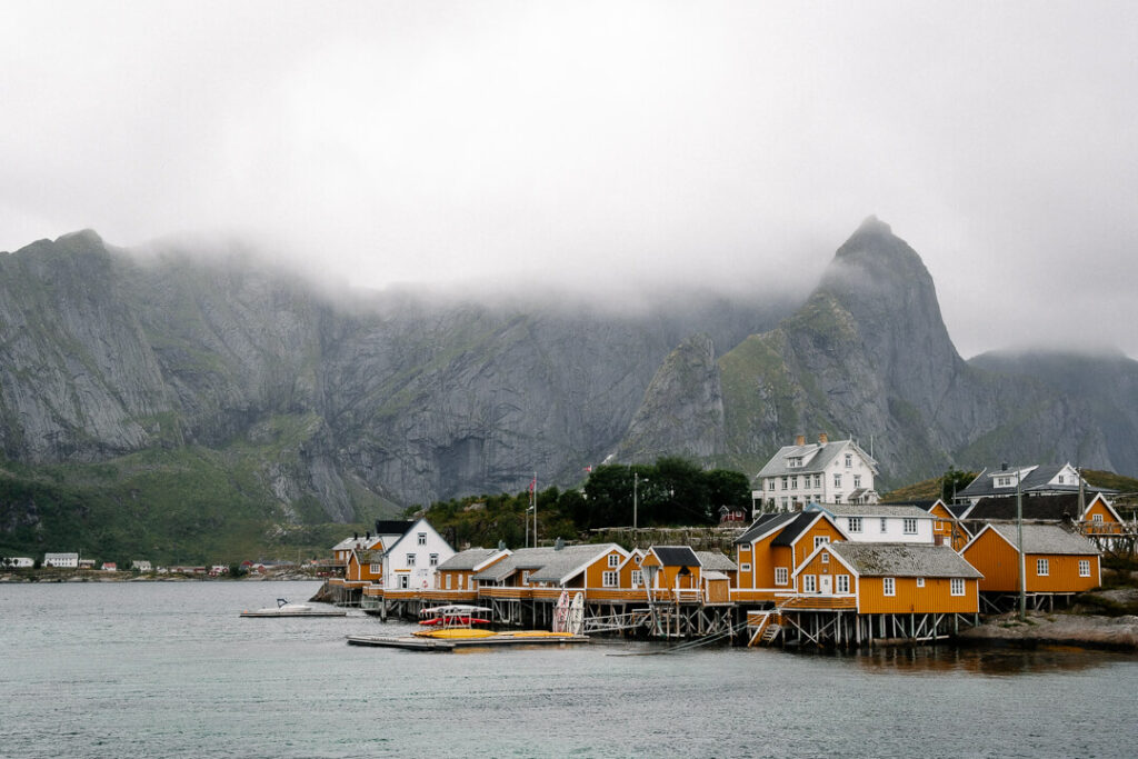 yellow houses in the fog hamnoy lofoten