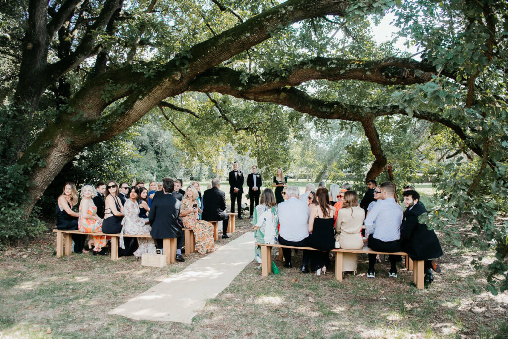 Wedding ceremony under the trees dreamy wedding Milie Del Photographer