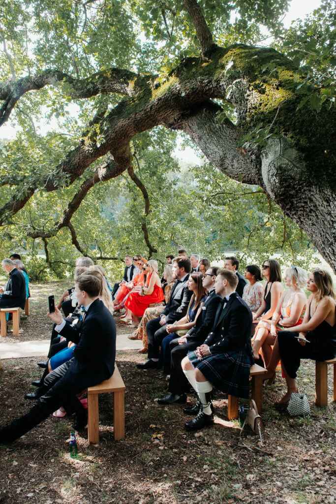 Wedding ceremony under the trees dreamy wedding Milie Del Photographer