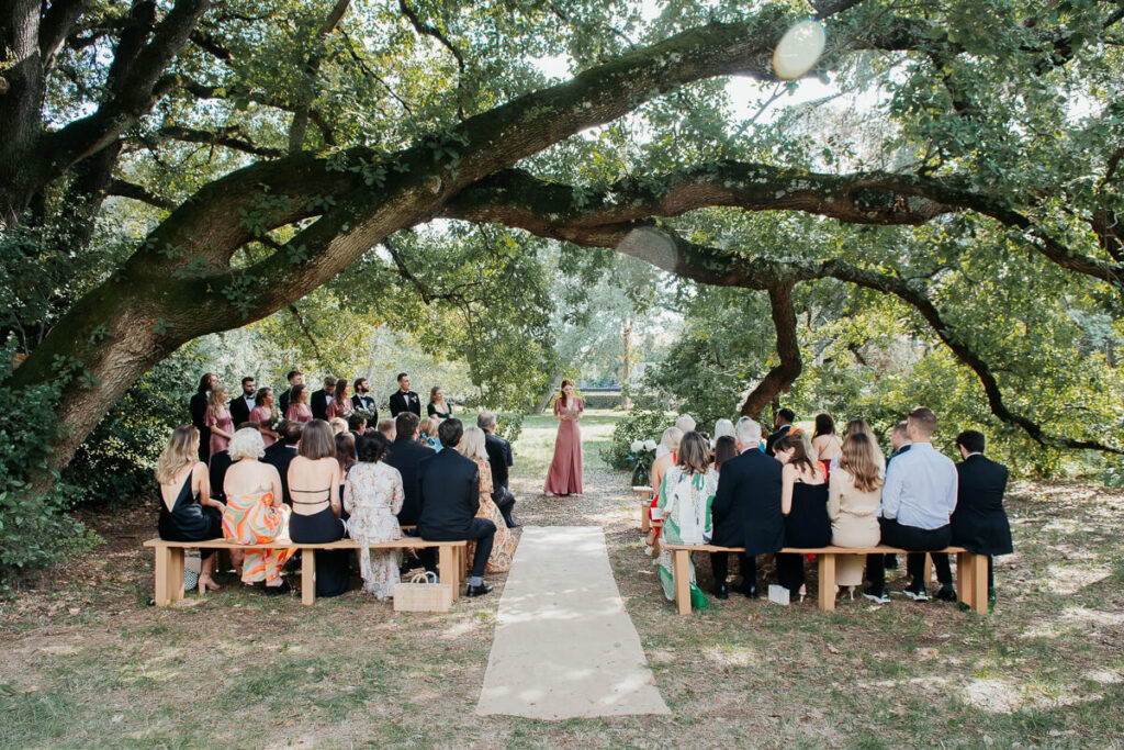 Wedding ceremony under the trees dreamy wedding Milie Del Photographer